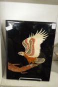 A lacquer plaque depicting an eagle on a branch.