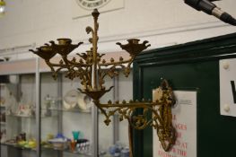 A pair of ornate wall mounted ormolu candelabra.