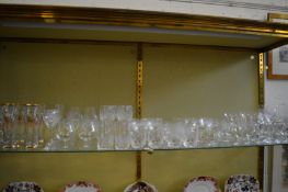 A shelf of drinking glasses.