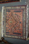 A Persian mat, pink ground with stylised decoration 70cm x 87cm.