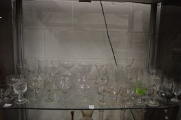 A shelf of drinking glasses.