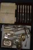 Items of small silverware to include a cased set of silver handled butter knives.
