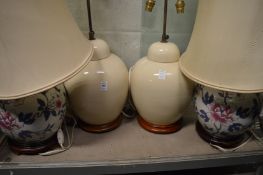 Two large pairs of Chinese style pottery table lamps.