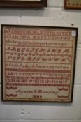 A large 19th century alphabet sampler, signed Agnes E Bunting, 1889.