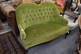 A Victorian green draylon button upholstered two seater settee.