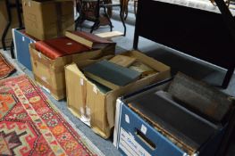 Five boxes of assorted books.