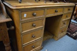 A 19th century pine kneehole desk or dressing table.