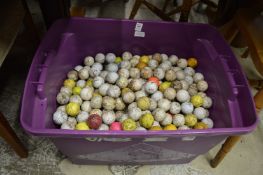A large quantity of used golf balls.