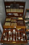 A mahogany cased twelve place canteen of cutlery.