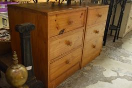 A pair of pine bedside chests.