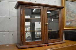 Two walnut hanging cabinets.