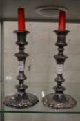 A pair of plated candlesticks.