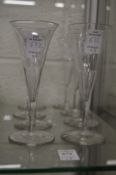 A set of eight 19th century cut glass flutes.