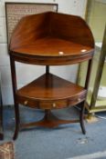 A mahogany corner washstand.