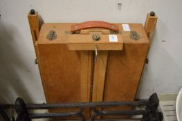 A travelling artists easel.