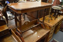 A Victorian walnut stretcher table.