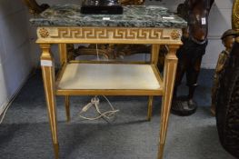 A pair of marble topped gilded and painted occasional tables with Greek key frieze.