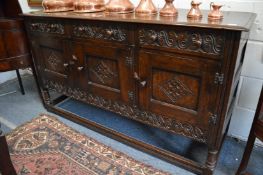 A good reproduction oak sideboard.