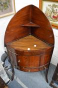 A mahogany corner washstand.