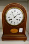 An Edwardian inlaid mahogany mantle clock.