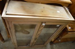 Pine two door display cabinet and two bookcases.