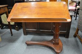 A Victorian mahogany adjustable bed table.