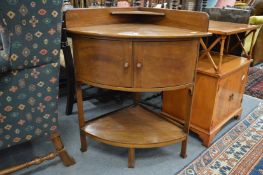 A mahogany corner washstand.