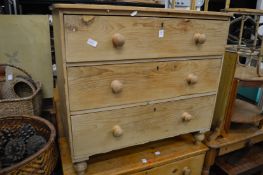 A pine three drawer chest.