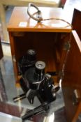 A Bausch & Lomb binocular microscope, cased.