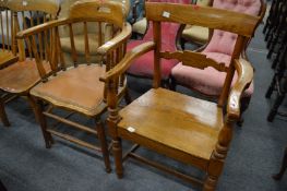 A spindle back armchair and an elm armchair.