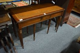 A mahogany rectangular leather inset nest of tables.