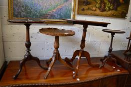 Four various mahogany tripod tables.
