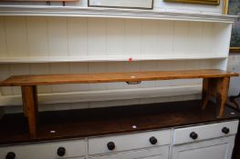 A fruit wood bench seat.