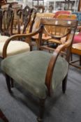 A Regency mahogany elbow chair.