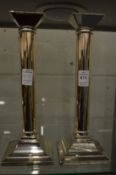 A pair of plated candlesticks.