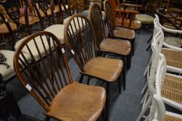 A set of four 19th century ash and elm stick back dining chairs.