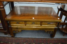 A Chinese elm coffee table with drawers running through to each side.