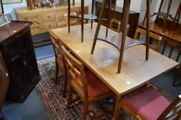 A good oak dining room suite in the Cotswold school style comprising, refectory dining table and six