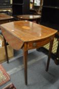 A George III mahogany and satinwood inlaid Pembroke table.