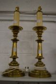 A pair of heavy brass lamp bases.