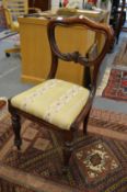A Victorian rosewood dining chair.