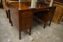 An oak twin pedestal desk.
