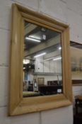 A pine framed mirror.