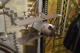 An unusual ceiling light fitting modelled as a biplane.