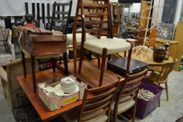 A stylish rectangular extending dining table with two leaves together with a set of eight matching