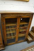 An oak two door bookcase.