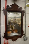 A small mahogany fretwork framed mirror.