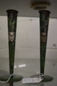 A pair of unusual patinated metal vases with silver overlay decoration.