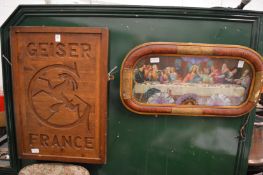carved wood plaque and a colour print of the Last Supper.