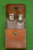 Leather cased miniature scent bottles.
